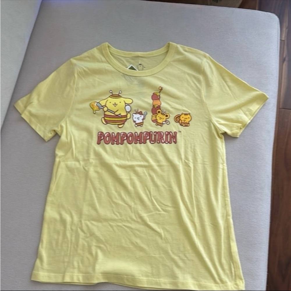 SANRIO POMPOMPURIN YELLOW GRAPHIC
T-SHIRT JUNIOR SIZE XS NWT - Picture 2 of 6
